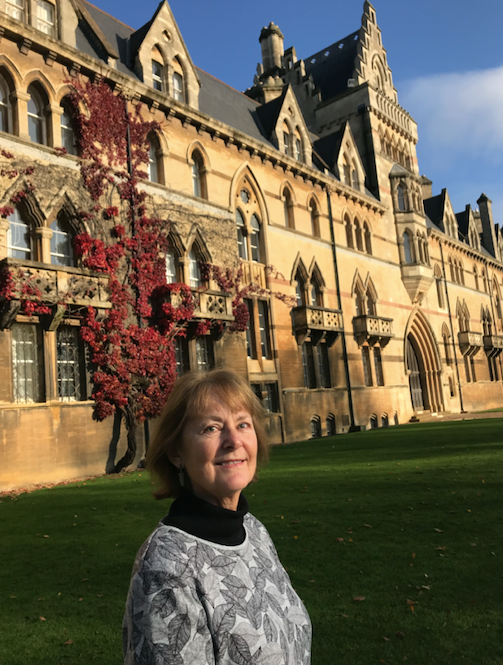 Dr. Cindy Farley stands by Christ Church College in Oxford England.
