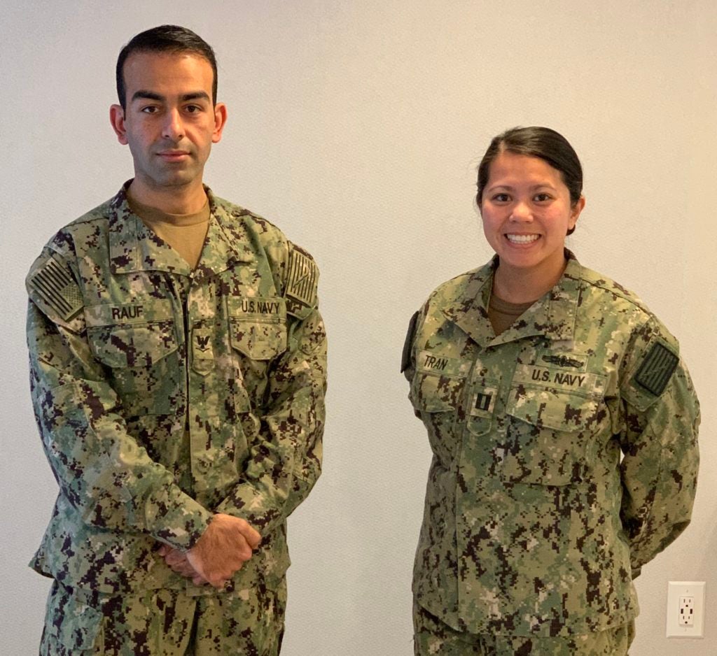 Tran with human science student Safiullah Rauf (NHS’21), who has also been working on the COVID-19 response. Both are in their Navy uniforms.