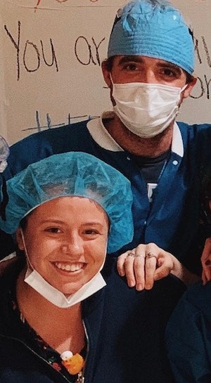 Olivia Gasser (NHS’18) and Samuel Taylor-D’Ambrosio (NHS’16) are photographed in their clinical attire.