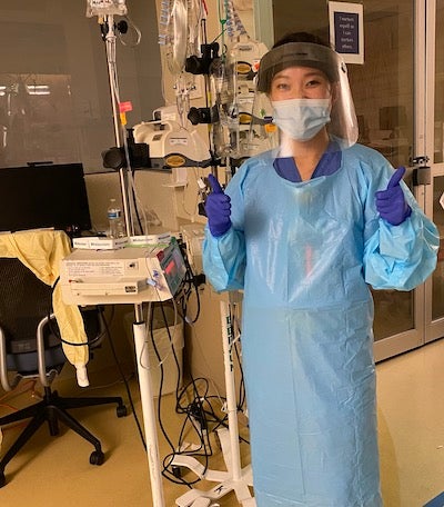 Emily Varua in a hospital setting wearing personal protective equipment