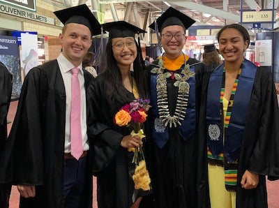 A group photo at Georgetown's Commencement at Nationals Park with individuals in academic gowns