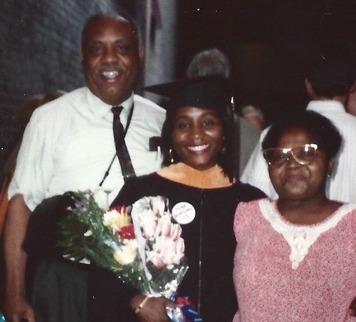 Roberta Waite stands with her parents