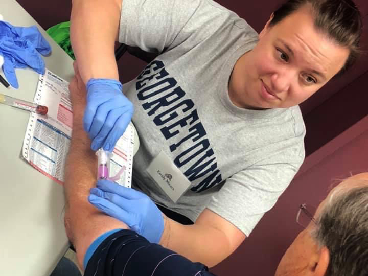 A nursing student draws blood from a West Virginia resident