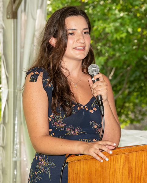 Marie Beauchamin speaks from a podium