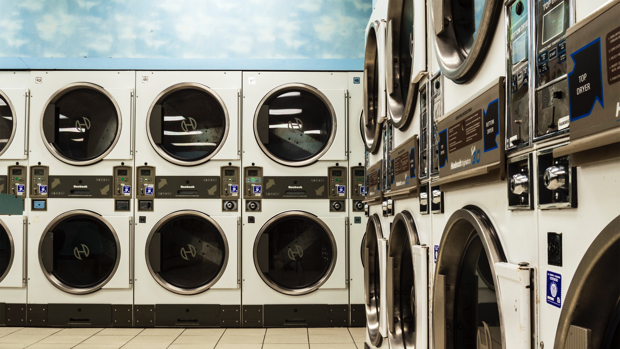 A bank of washing machines in a laundromat