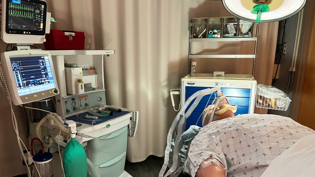 A mannequin with anesthesia equipment in the SIM Lab