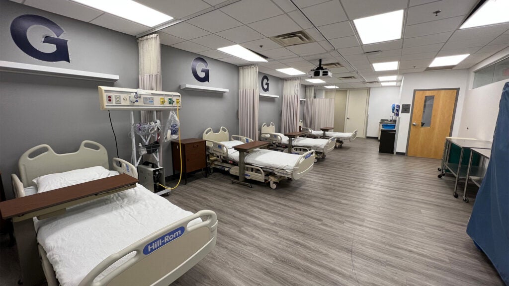 The SIM lab room with four hospital beds and equipment