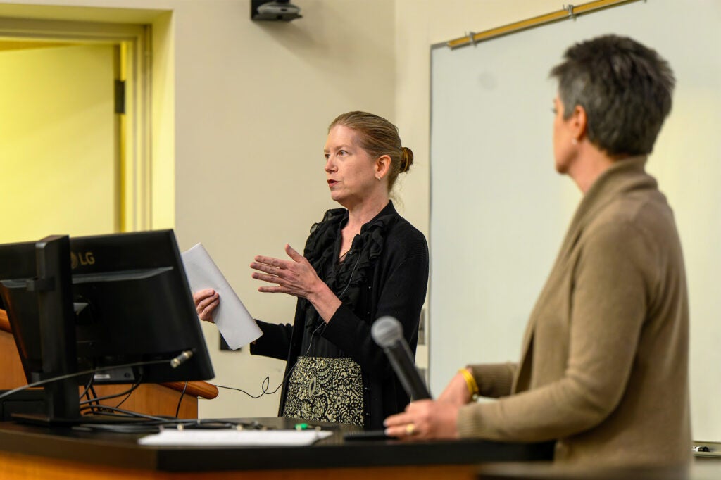 A student speaks while Dr. White looks on
