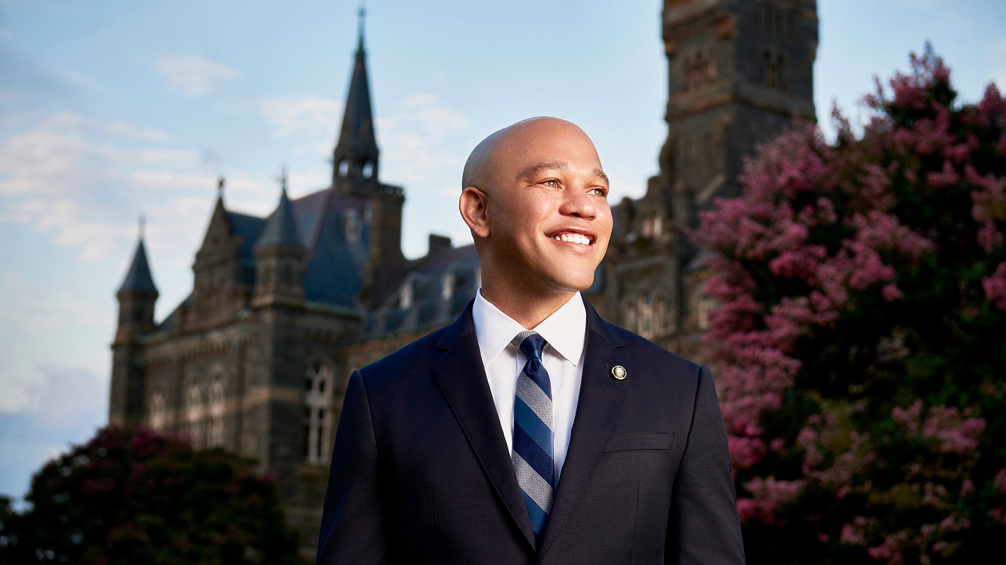 Stephan Davis stands with Healy Hall in the background