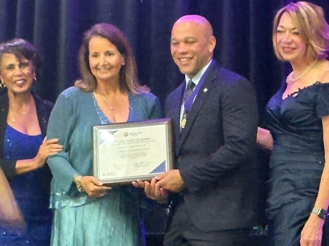 Stephan Davis, DNP, MHSA, NEA-BC, CENP, CPHQ, CNE, FACHE, FAAN, being inducted as a fellow in the NLN Academy of Nursing Education.