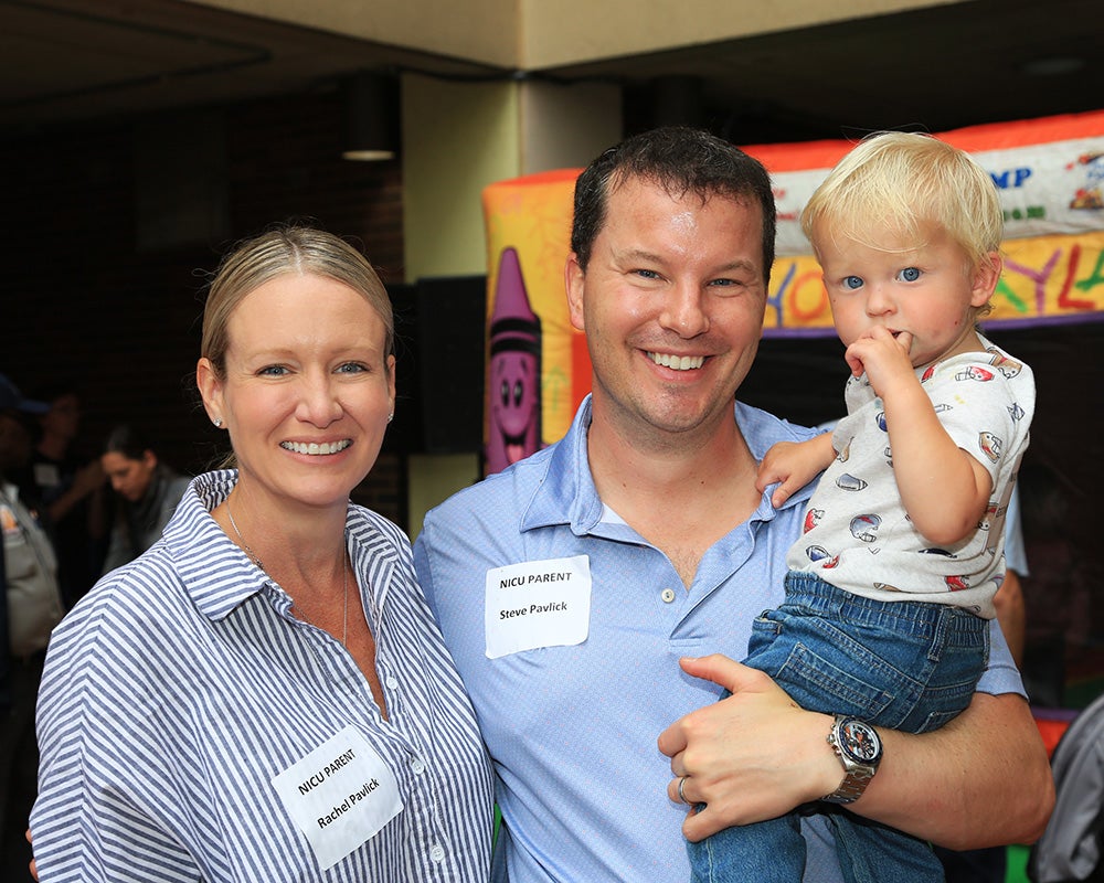 Two parents with their young child