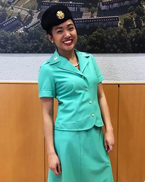 Jaclyn Sison in a dress Navy uniform with hat