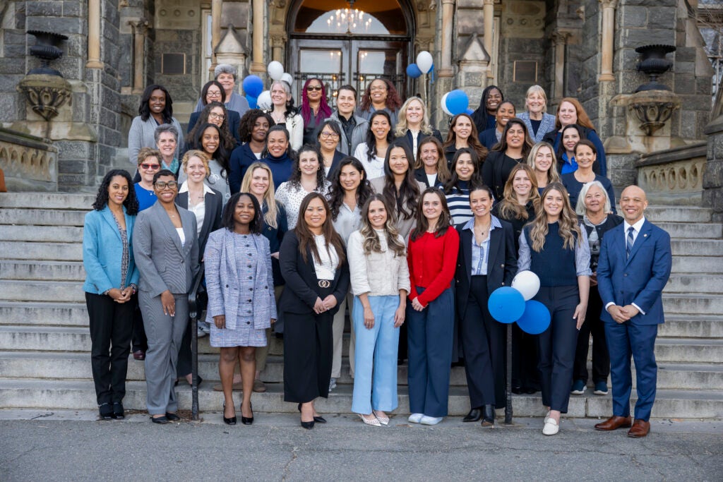 DNP students and faculty gathered on the steps of Healy Hall.