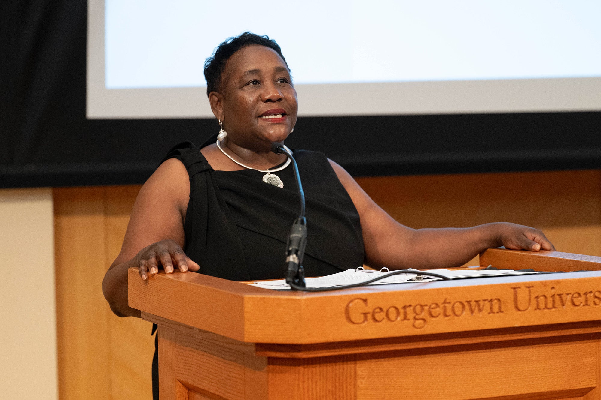 Roberta Waite speaks from a podium