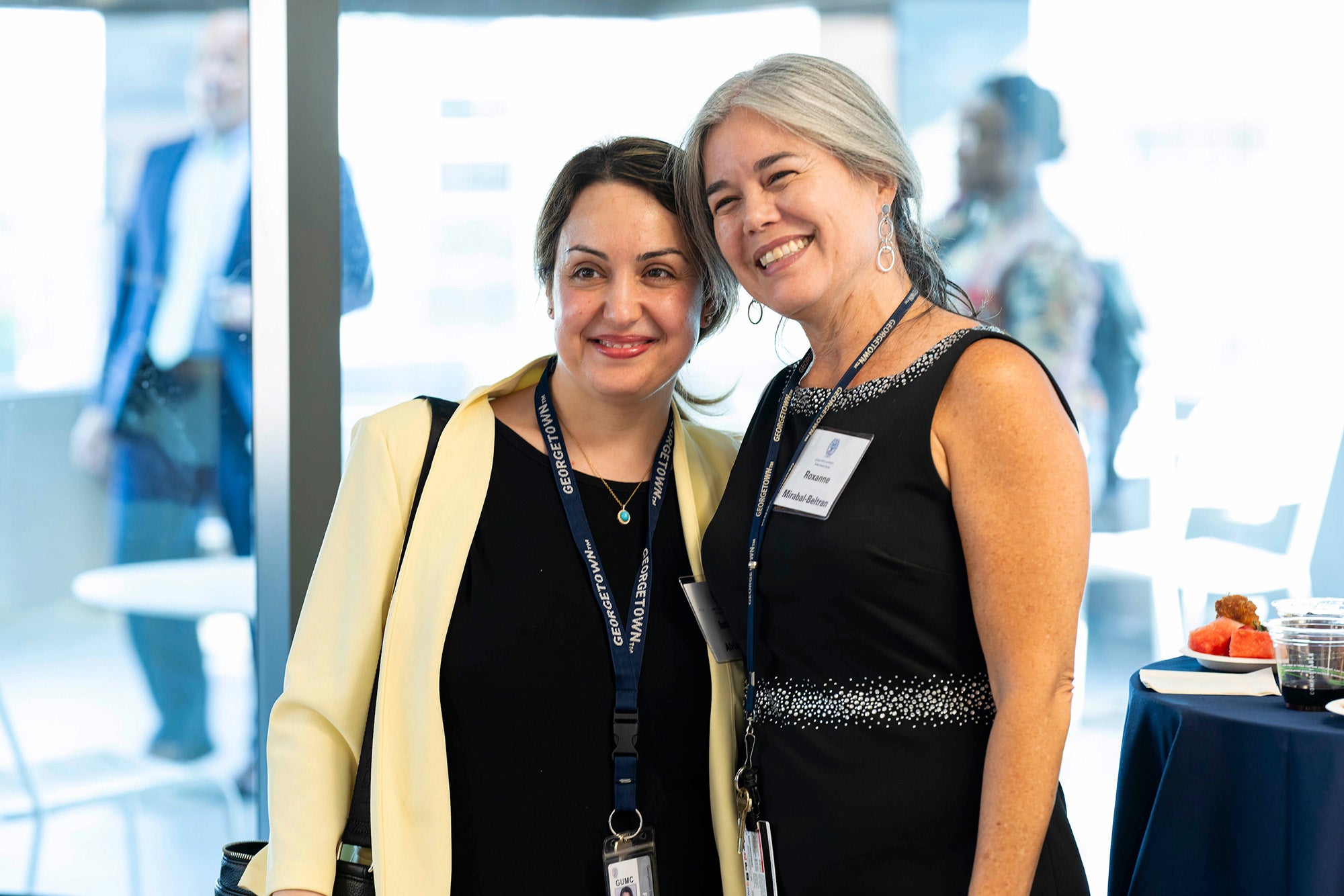 Roxanne Mirabal-Beltran and Intima Alrimawi stand together