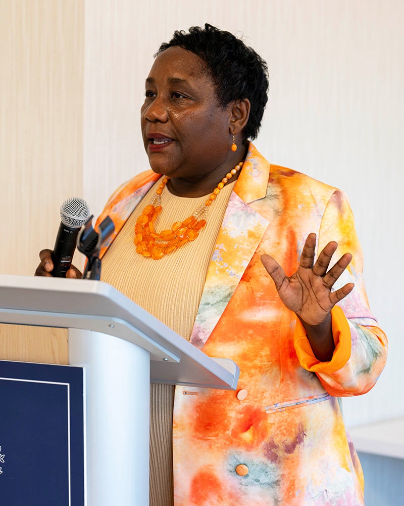 Dean Roberta Waite speaks from a podium at the reception