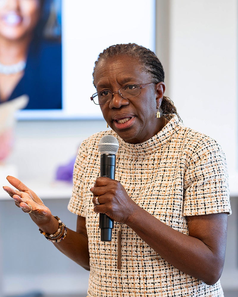 Edilma Yearwood speaks into a microphone at the PhD in Nursing reception
