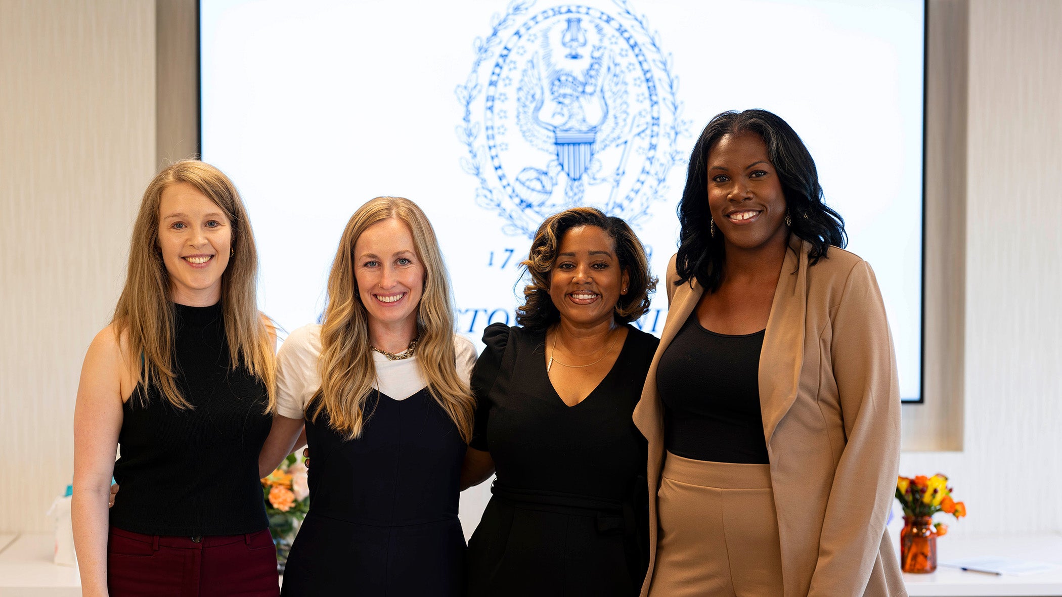 Four PhD in Nursing students stand side by side