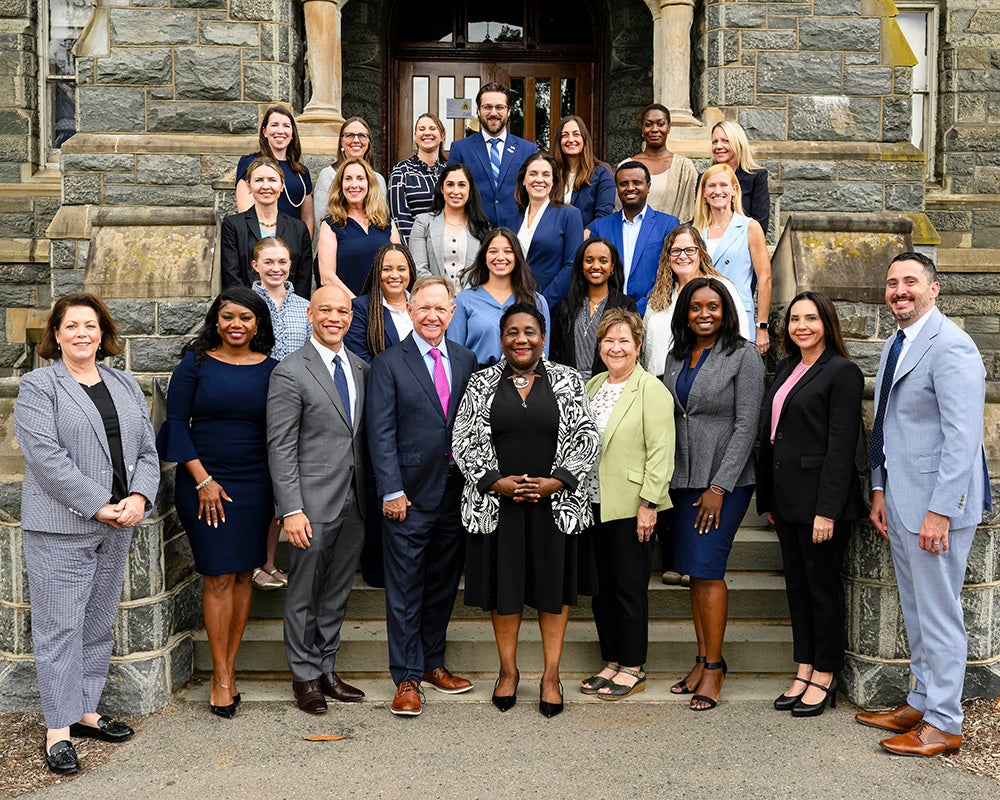 Executive DNP students and faculty stand together on the steps of Healy Hall