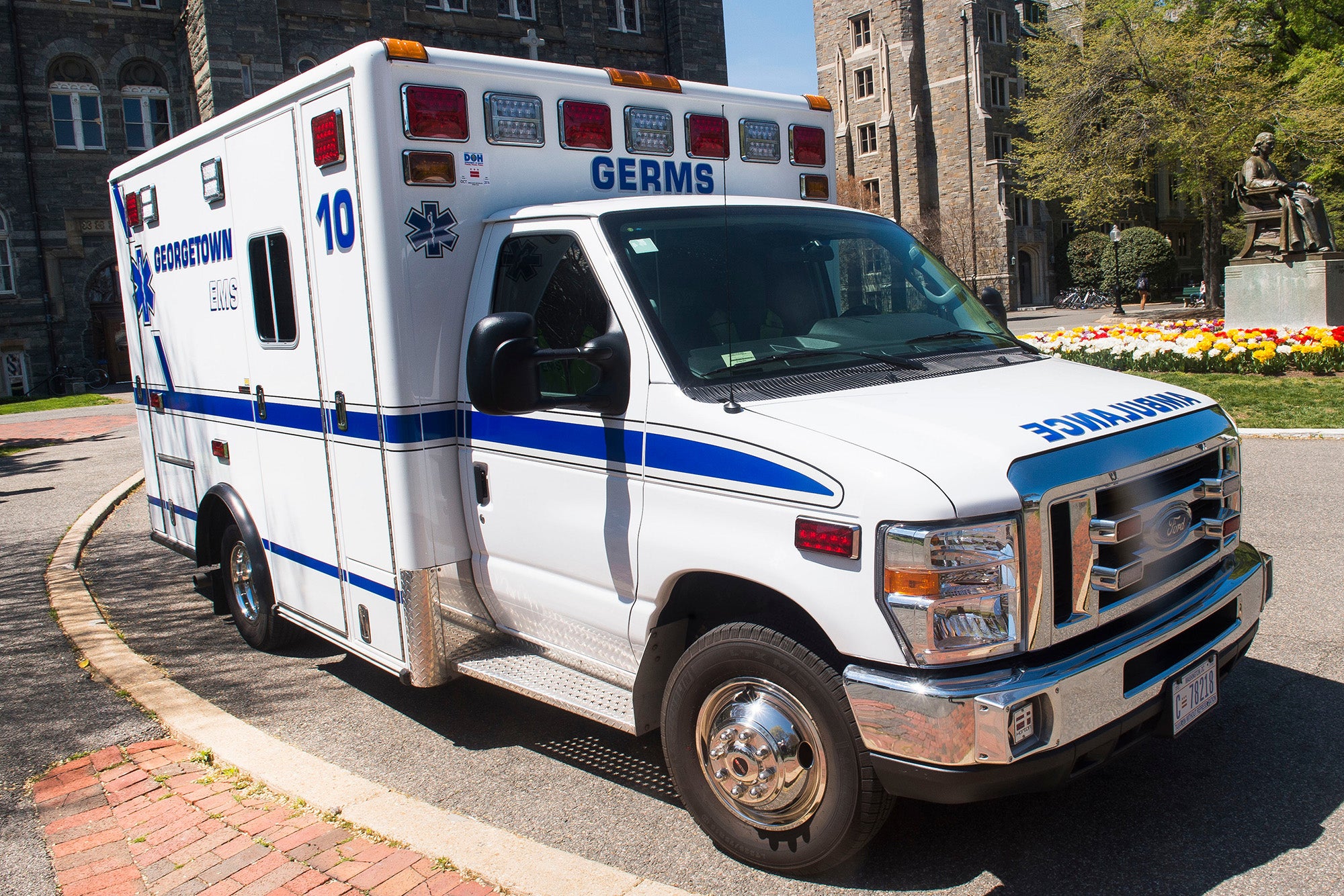 A GERMS ambulance parked near the John Carroll statue in front of Healy Hall