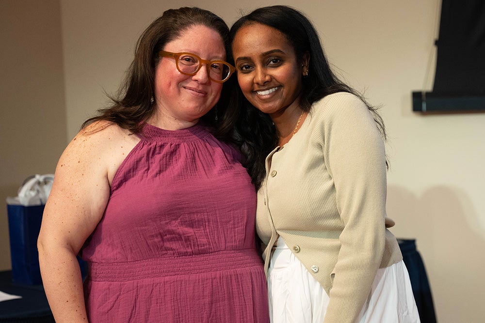 Terhass Yosief stands with Melicia Escobar