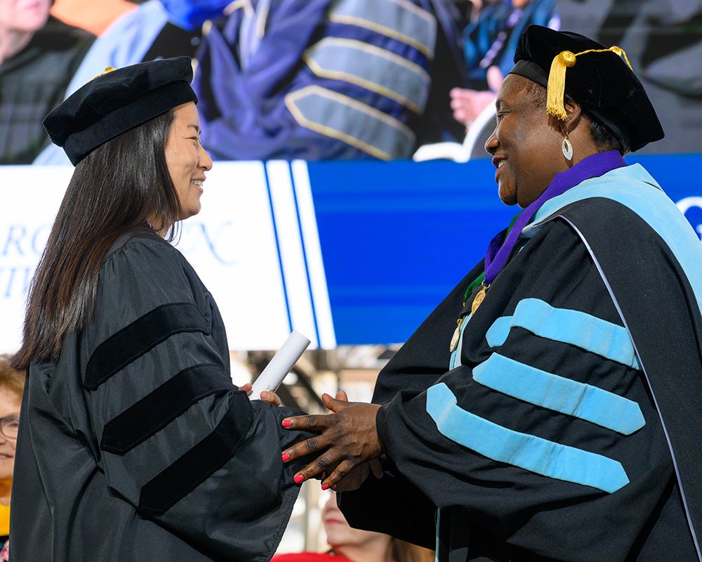 Dean Waite congratulates a student