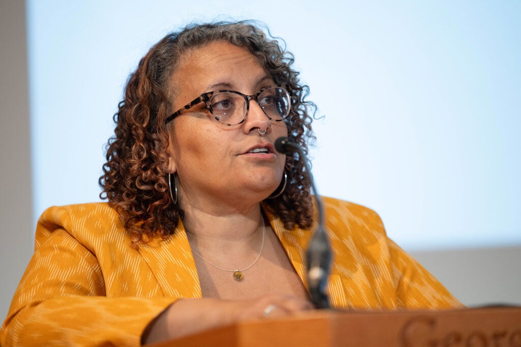 Mari-Carmen Farmer speaks from a podium
