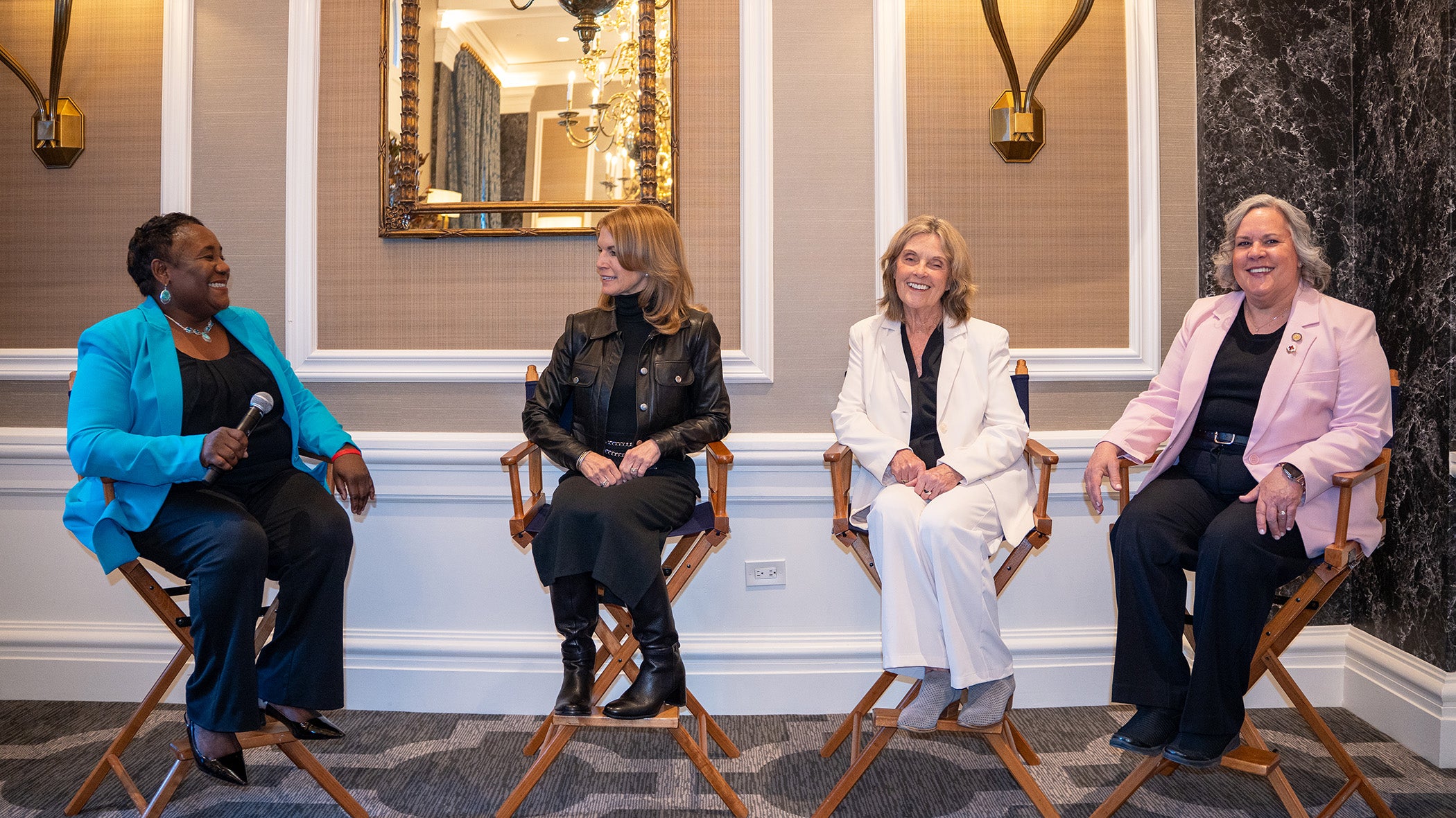 Four individuals sit in chairs
