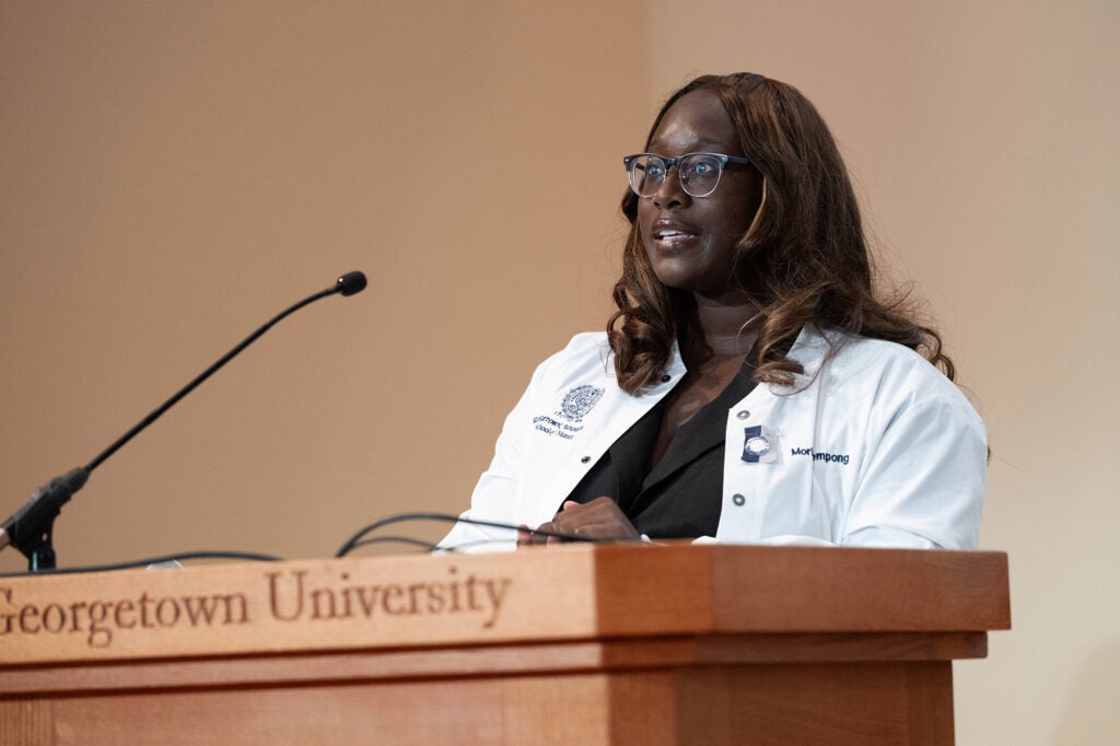 Moriah Bempong speaks from a podium